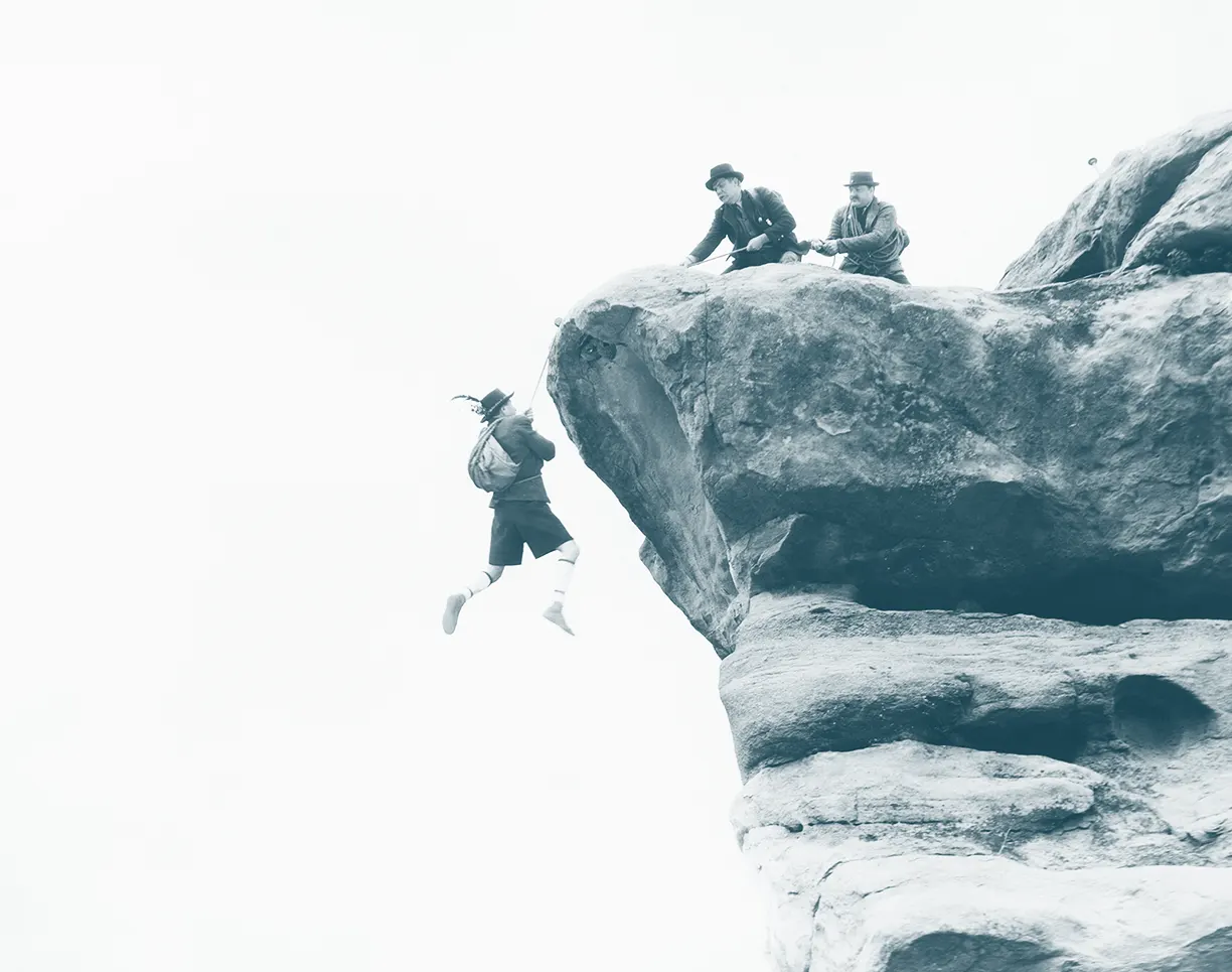 Two Men Rescuing A Man from The Cliff