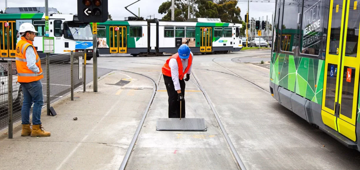 A Man with Blue Helmet Covering A Manhole