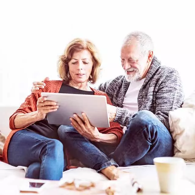 Senior Couples Looking at the Tablet