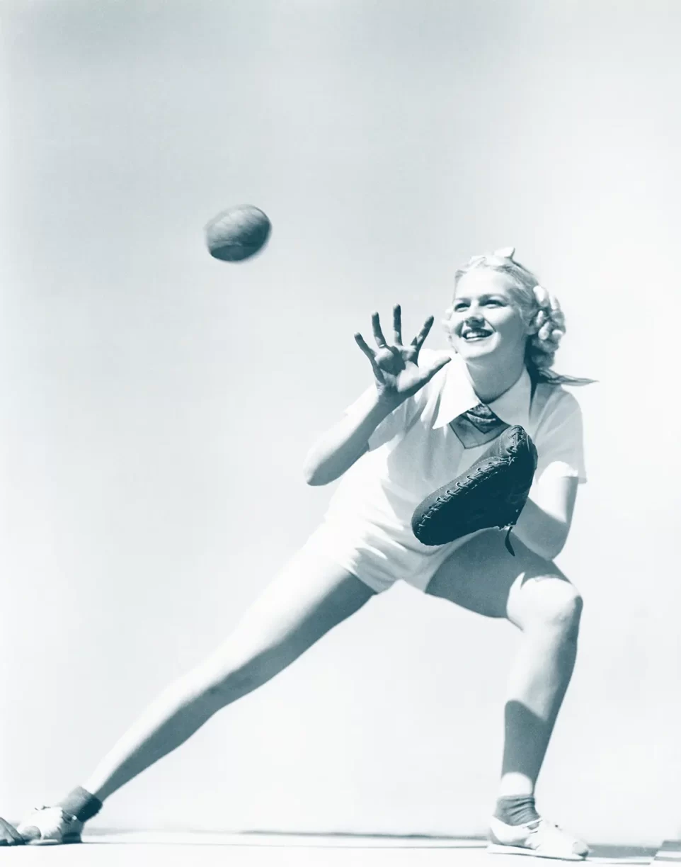 Woman with Baseball Gloves Catching The Ball