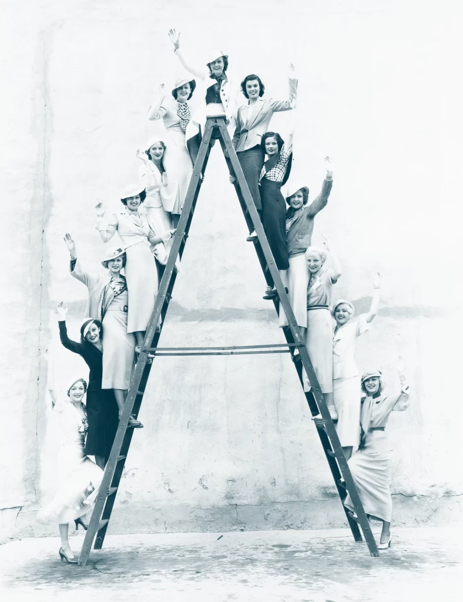 Women Lining Up on A Ladder