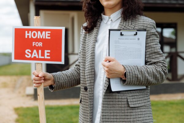 Woman holding signage.