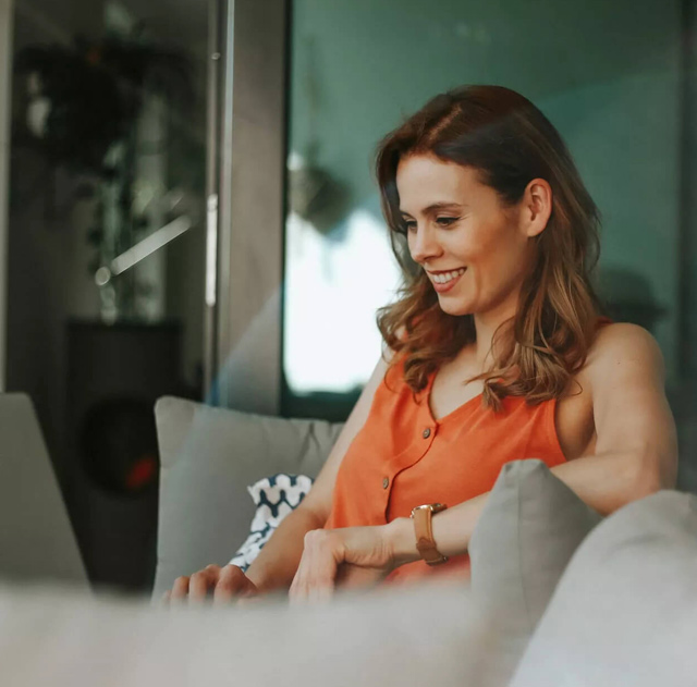 Smiling Woman on the Couch