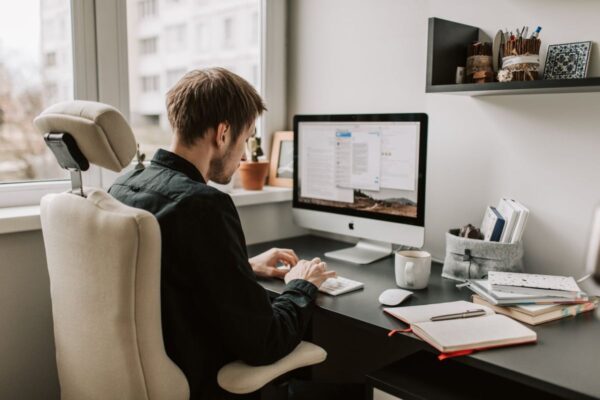Guy Using A Computer to Chat