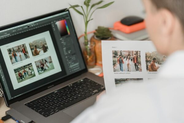 Man Editing A Photo With Adobe Photoshop